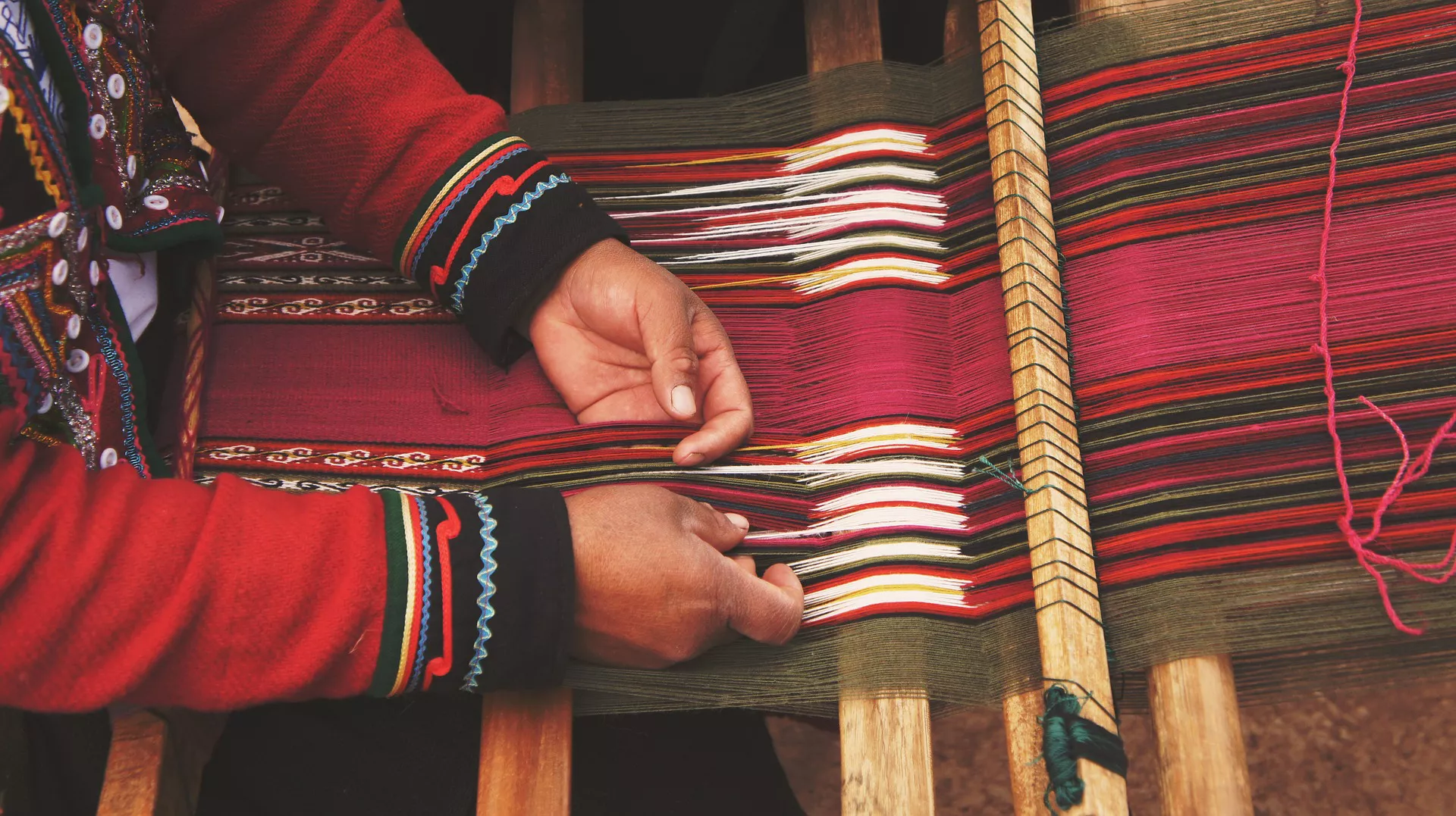 woman handweaving a shawl 